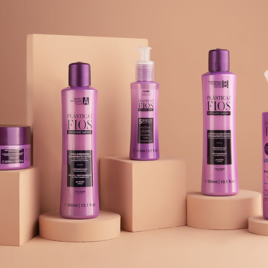 Set of Plastica Dos  Fios hair care products on beige stands against a beige background