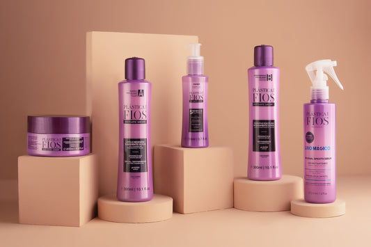 Set of Plastica Dos  Fios hair care products on beige stands against a beige background